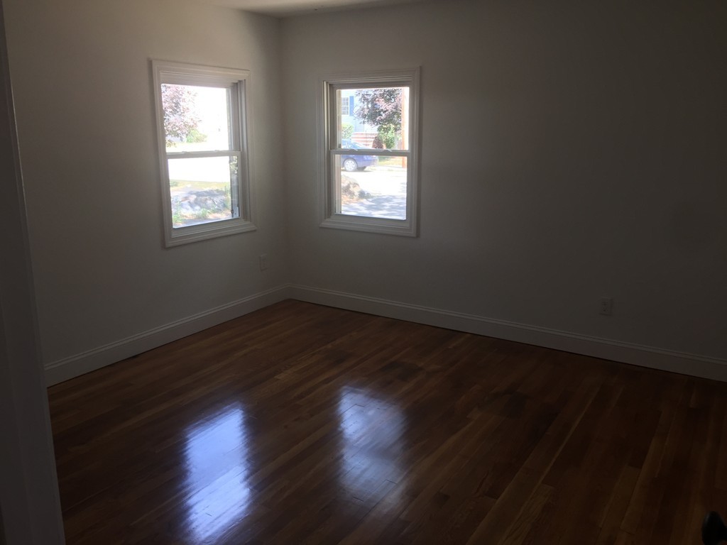 28 Bulfinch Terrace Lynn, MA 01902 - Photo 16 of 30 a view of wooden floor and windows in a room