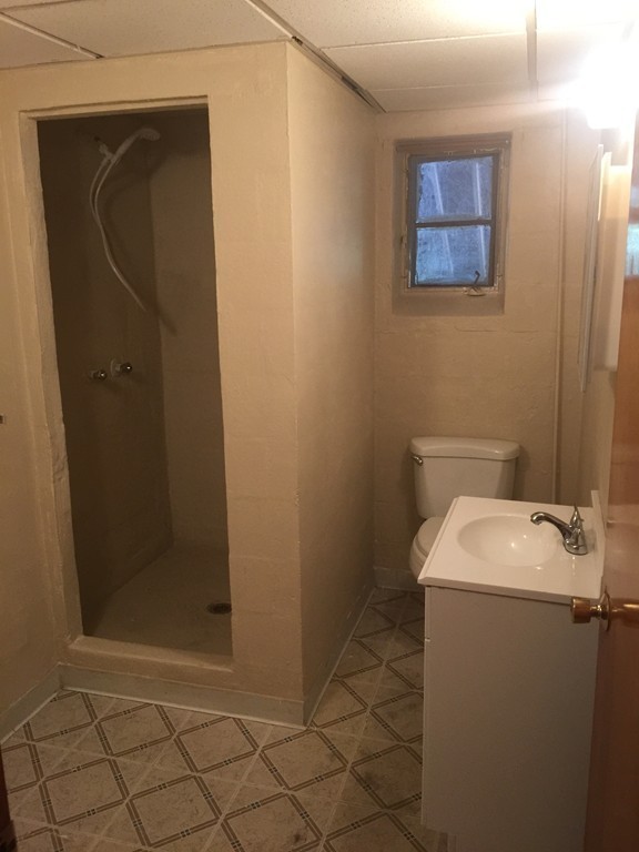 28 Bulfinch Terrace Lynn, MA 01902 - Photo 23 of 30 a bathroom with a sink and a mirror