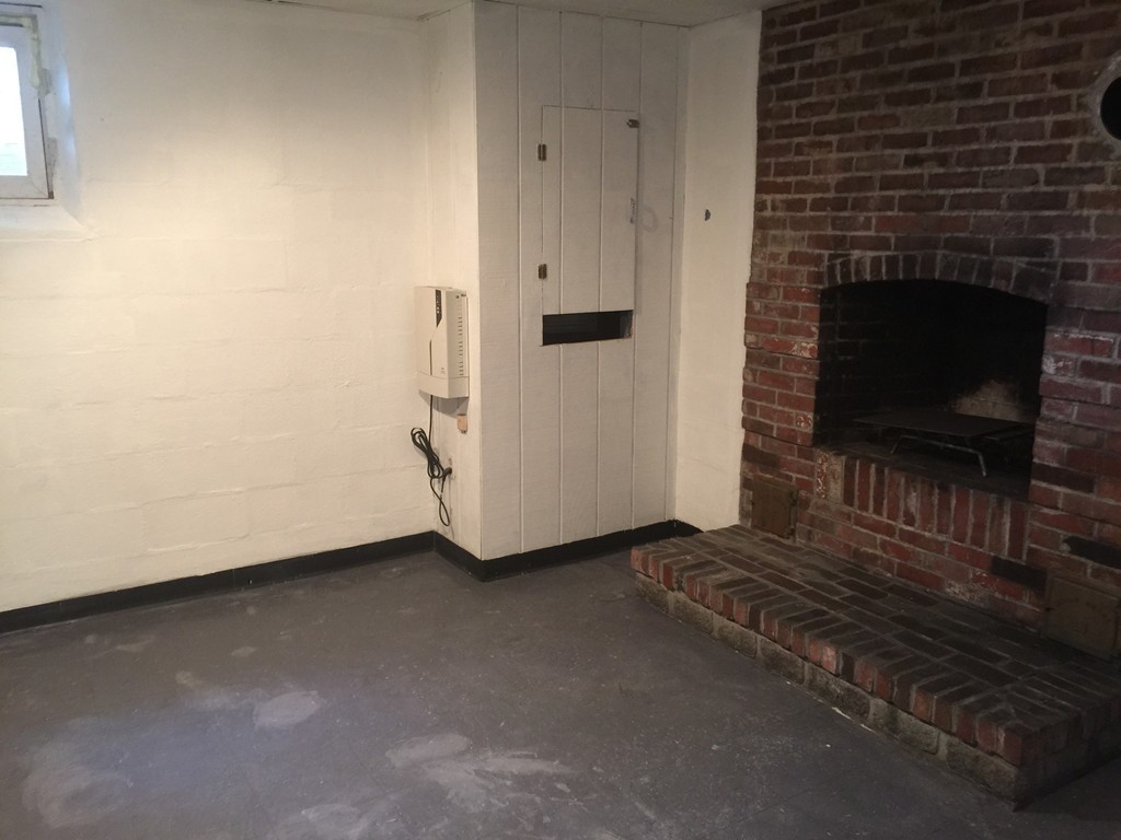 28 Bulfinch Terrace Lynn, MA 01902 - Photo 25 of 30 a view of a livingroom with wooden floor and a fireplace