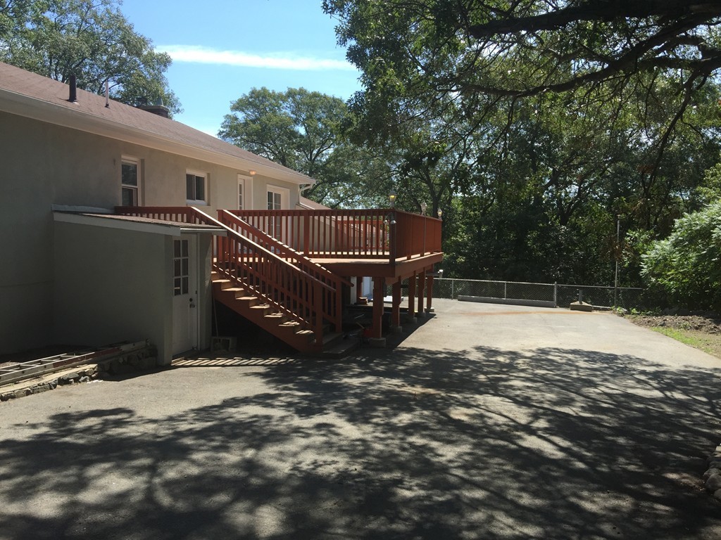 28 Bulfinch Terrace Lynn, MA 01902 - Photo 4 of 30 a view of a yard with wooden fence