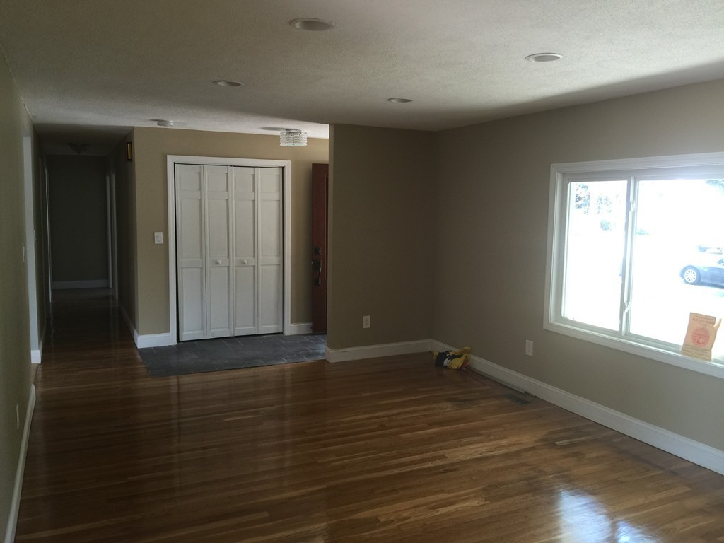 28 Bulfinch Terrace Lynn, MA 01902 - Photo 10 of 30 an empty room with wooden floor and windows