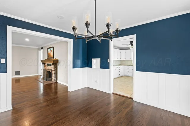 a view of a kitchen with wooden floor