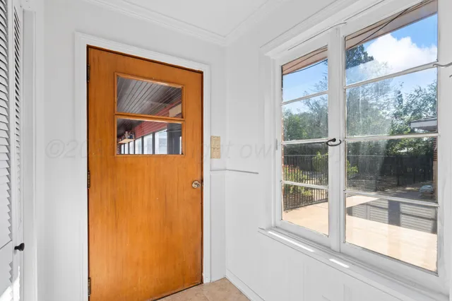 a view of a door and a window