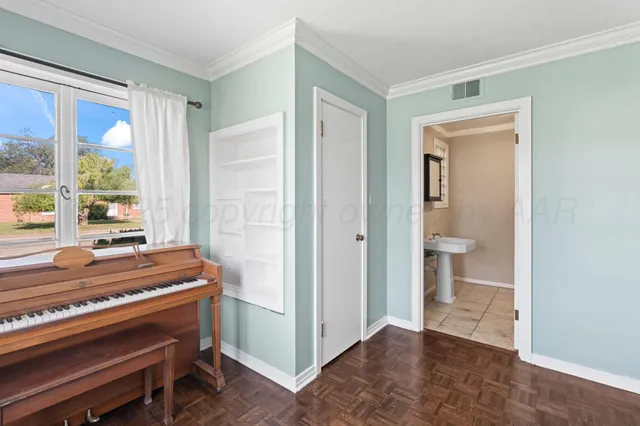 a view of room with window and wooden floor