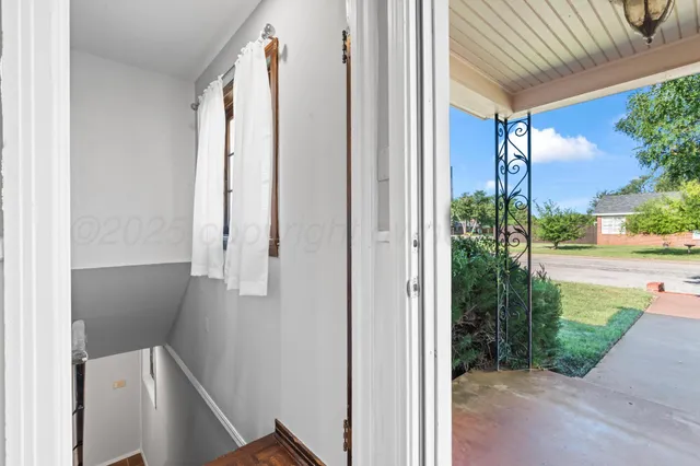 a view of an empty room with stairs