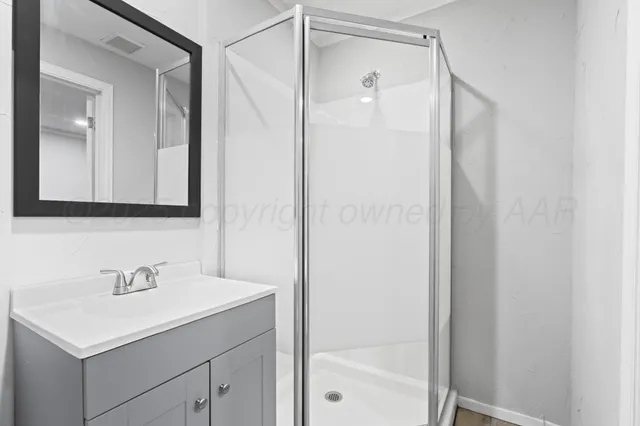 an empty room with closet and cabinet