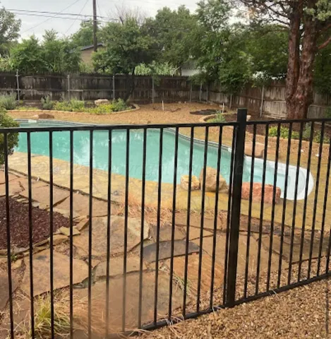 a view of a swimming pool with a patio