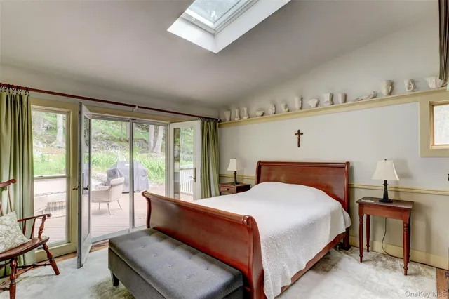 a bedroom with a large bed and a window