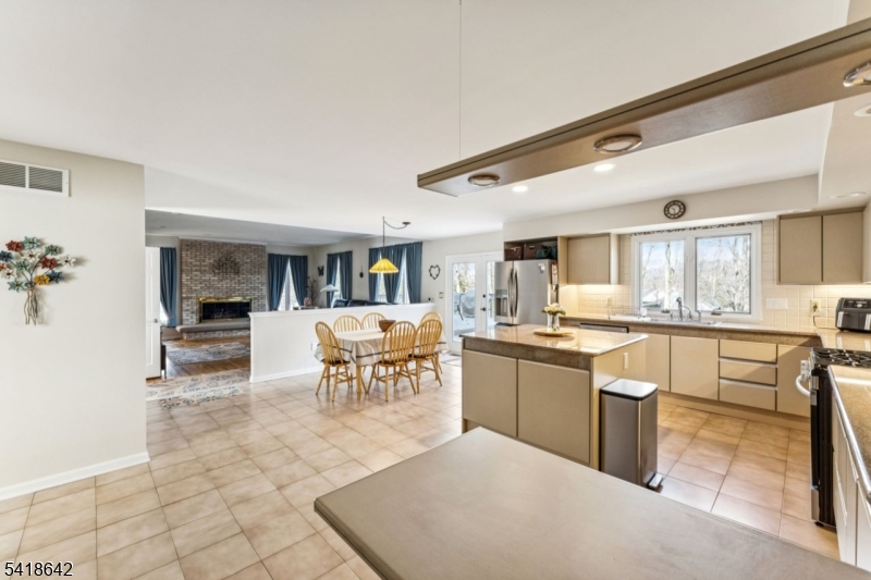 11 North Ridge Road Denville, NJ 07834 - Photo 14 of 43 a kitchen with stainless steel appliances granite countertop a sink and cabinets