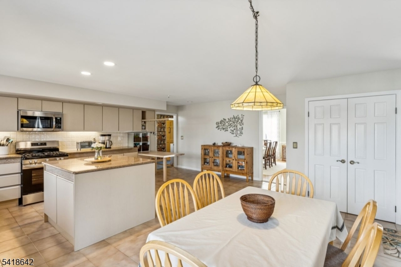 11 North Ridge Road Denville, NJ 07834 - Photo 17 of 43 a kitchen with lots of counter top space and living room