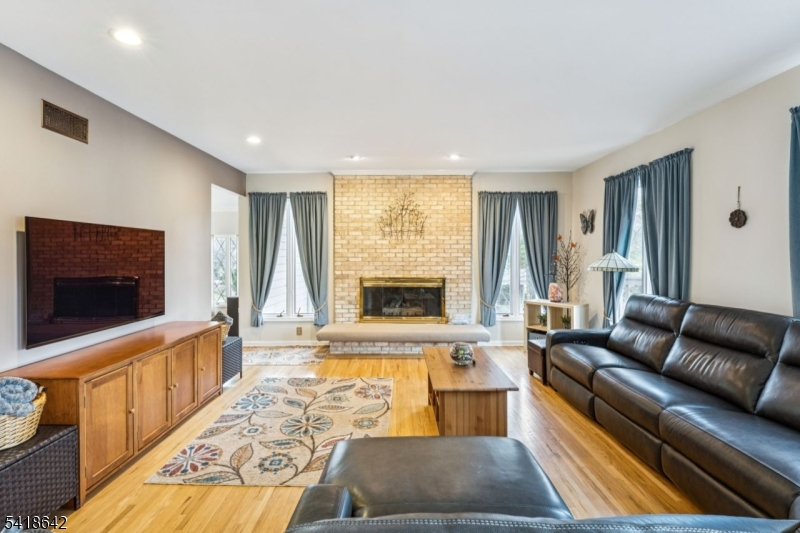 11 North Ridge Road Denville, NJ 07834 - Photo 18 of 43 a living room with furniture and a flat screen tv