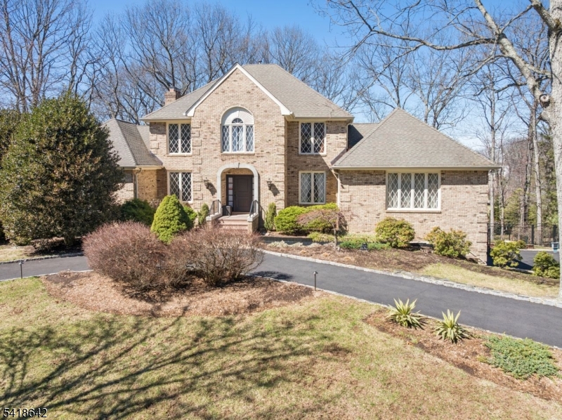 11 North Ridge Road Denville, NJ 07834 - Photo 2 of 43 a front view of a house with a yard and potted plants