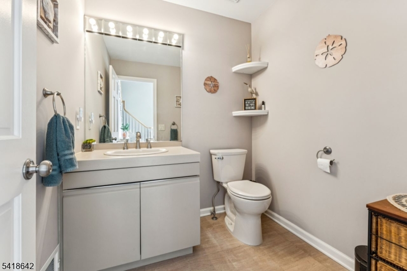 11 North Ridge Road Denville, NJ 07834 - Photo 22 of 43 a bathroom with a toilet sink and mirror