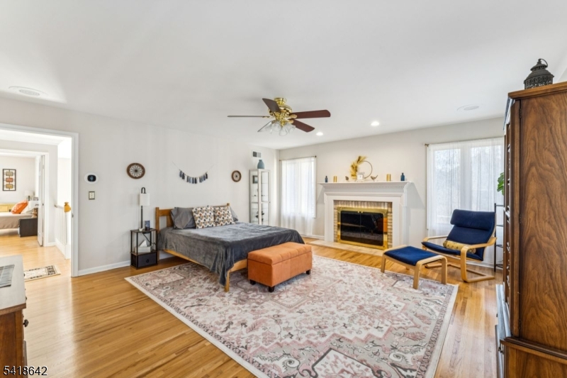 11 North Ridge Road Denville, NJ 07834 - Photo 29 of 43 a living room with furniture and a fireplace