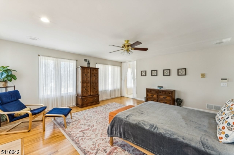 11 North Ridge Road Denville, NJ 07834 - Photo 31 of 43 a bedroom with a bed and wooden floor