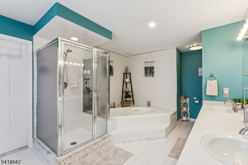 11 North Ridge Road Denville, NJ 07834 - Photo 32 of 43 a bathroom with a tub shower and sink