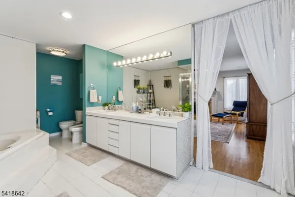 a bathroom with a sink vanity and a mirror