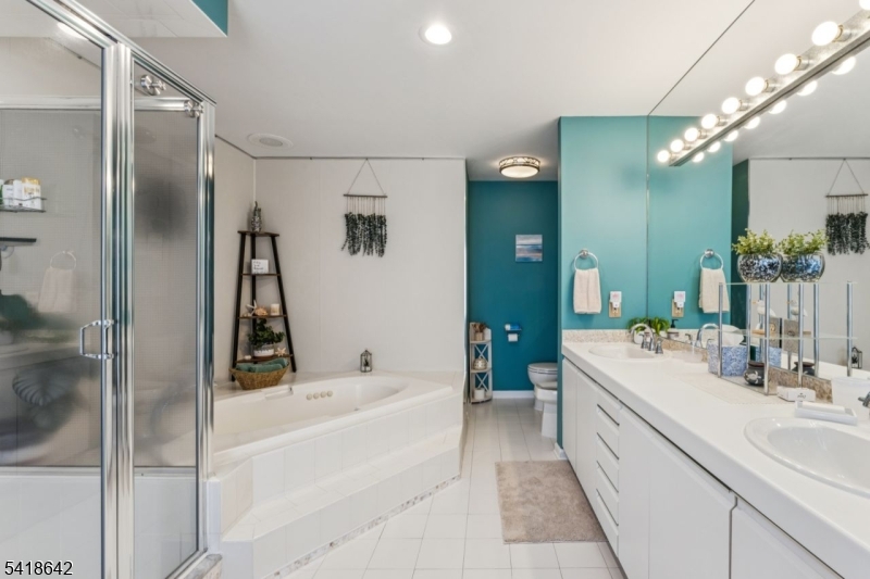 11 North Ridge Road Denville, NJ 07834 - Photo 34 of 43 a bathroom with a tub sink shower and mirror