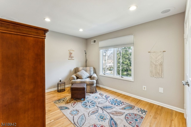 11 North Ridge Road Denville, NJ 07834 - Photo 35 of 43 a living room with furniture and a gate