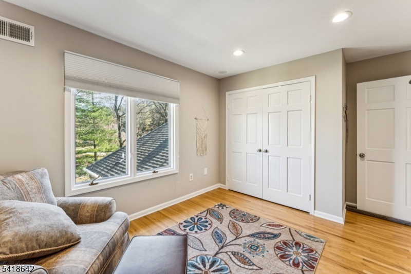11 North Ridge Road Denville, NJ 07834 - Photo 36 of 43 a bedroom with a bed and wooden floor
