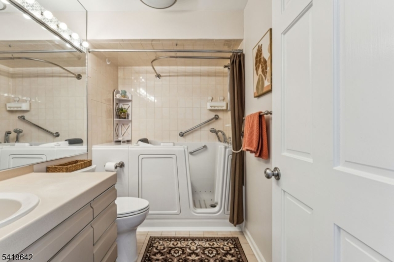 11 North Ridge Road Denville, NJ 07834 - Photo 39 of 43 a bathroom with a granite countertop sink toilet and shower