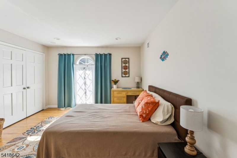 11 North Ridge Road Denville, NJ 07834 - Photo 40 of 43 a bedroom with a bed and wooden floor