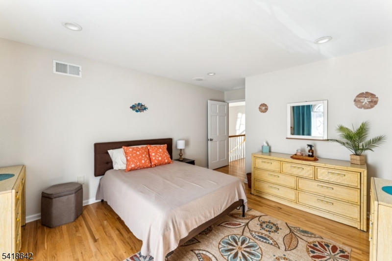 11 North Ridge Road Denville, NJ 07834 - Photo 41 of 43 a bedroom with a bed and a dresser in it