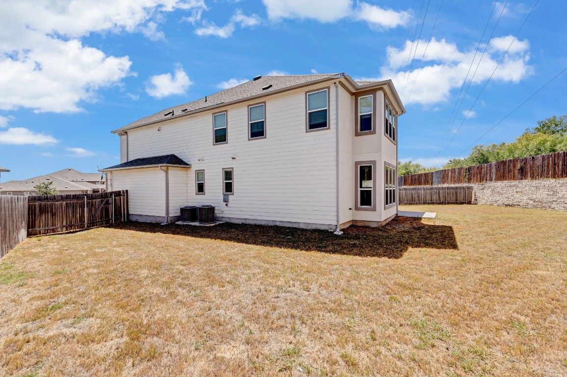 195 Azure Cove Kyle, TX 78640 - Photo 3 of 32 Rear view of property featuring a fenced backyard