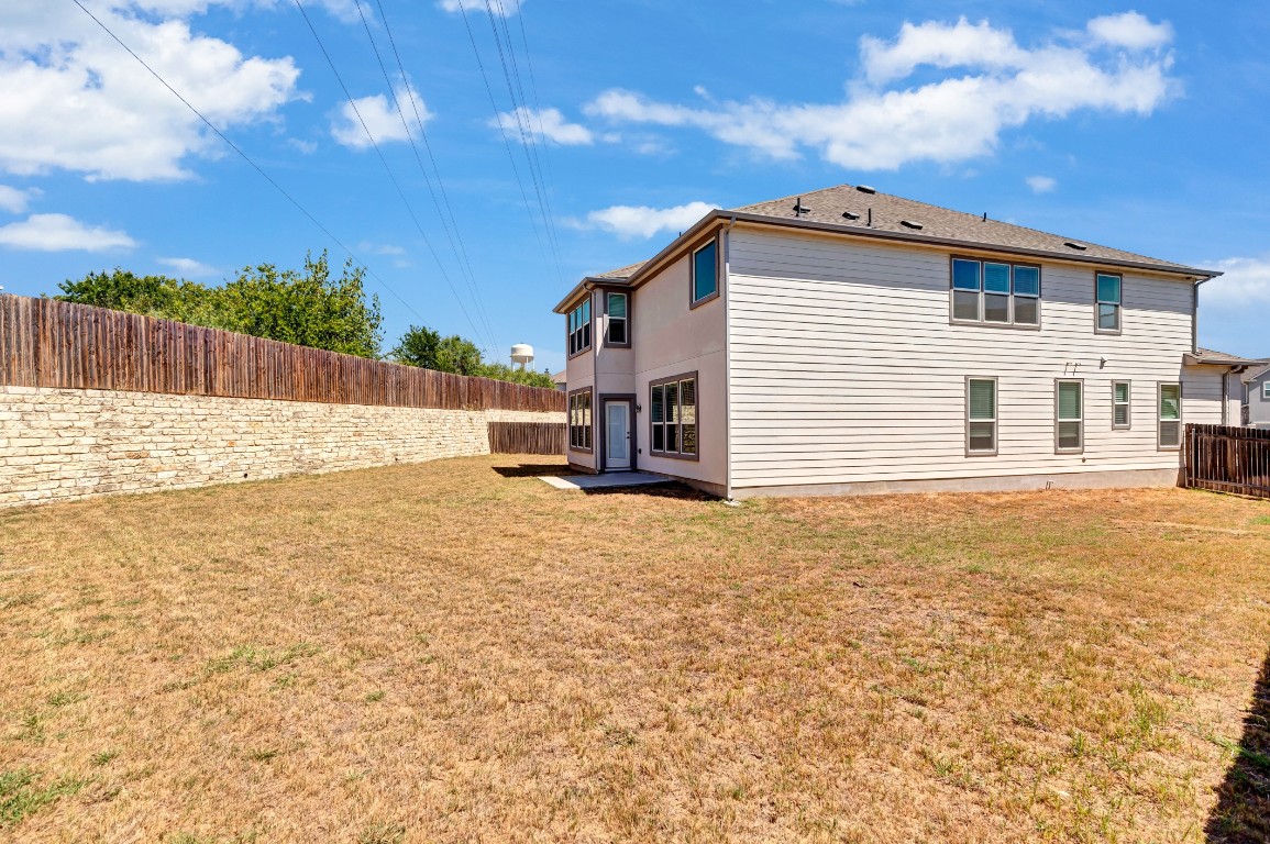 195 Azure Cove Kyle, TX 78640 - Photo 4 of 32 Rear view of property featuring a fenced backyard
