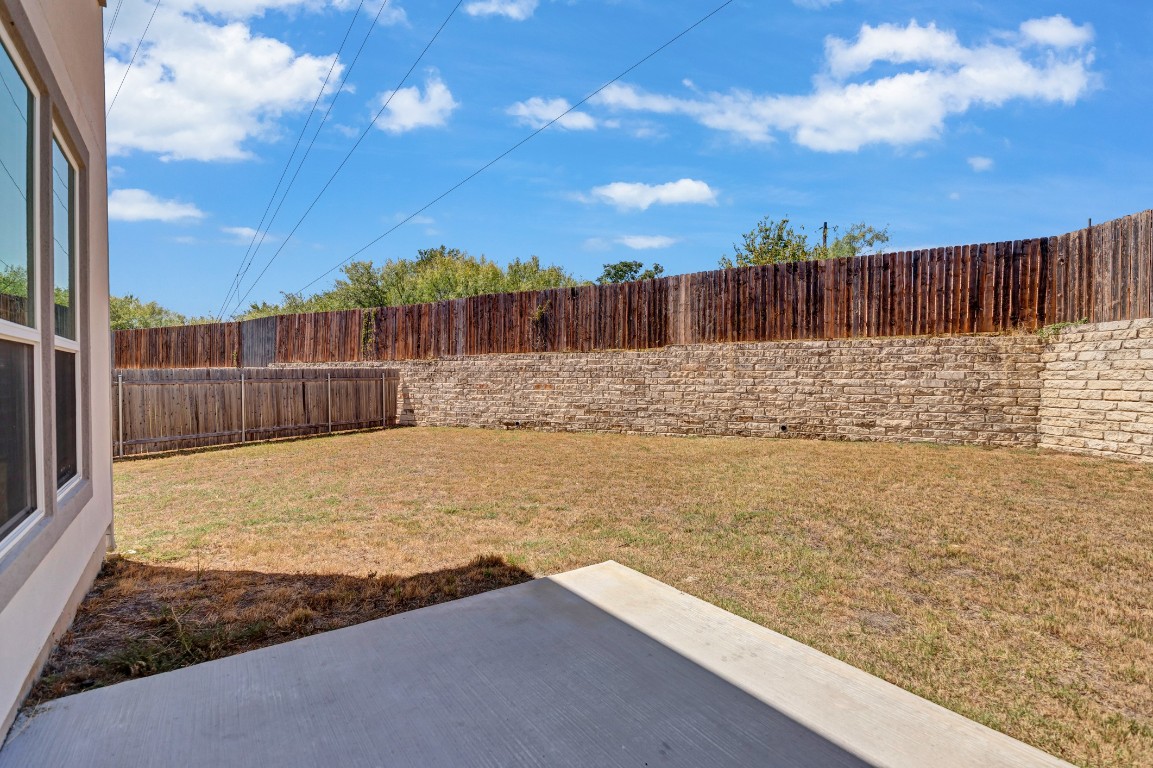 195 Azure Cove Kyle, TX 78640 - Photo 5 of 32 View of fenced backyard