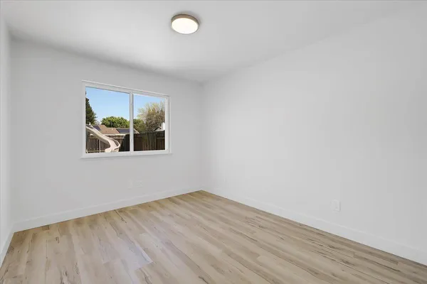 a kitchen with stainless steel appliances granite countertop a sink and a stove
