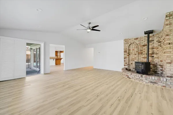 a view of empty room with floor to ceiling window