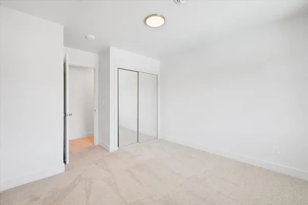 a view of a house with backyard and porch