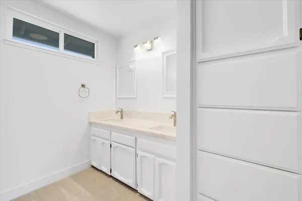 a view of a house with backyard and a garden