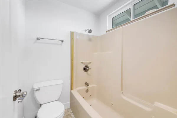 a view of a house with a swimming pool and a yard