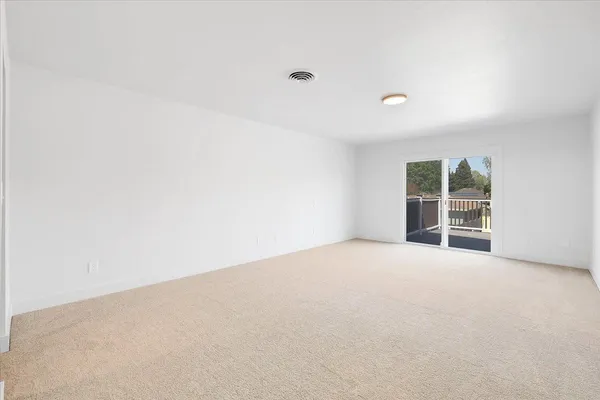a view of a house with backyard and a garden