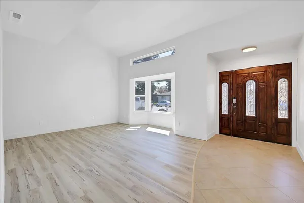 a view of entryway with wooden floor