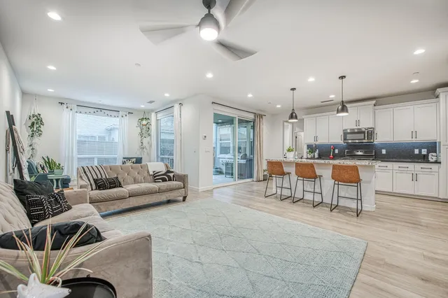 a living room with furniture and a window