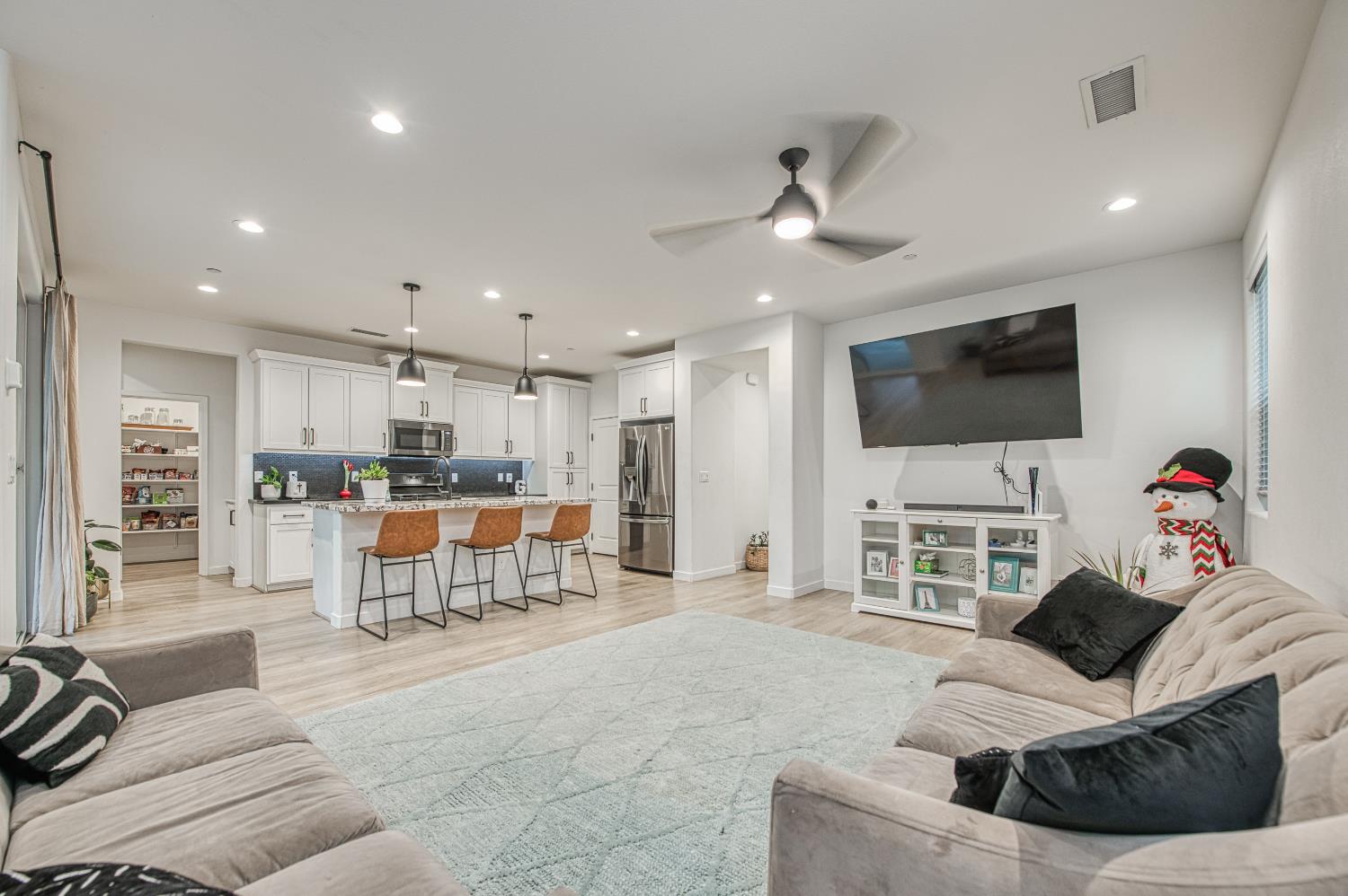 4311 San Miguel Road Madera, CA 93636 - Photo 13 of 79 a living room with furniture and a flat screen tv