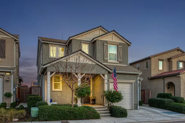 a front view of a house with garage