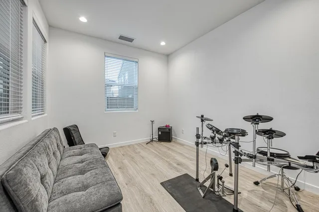 a spacious bedroom with a bed and a window