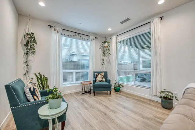 a bedroom with furniture and a window