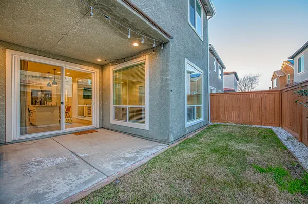 a front view of a houses with yard
