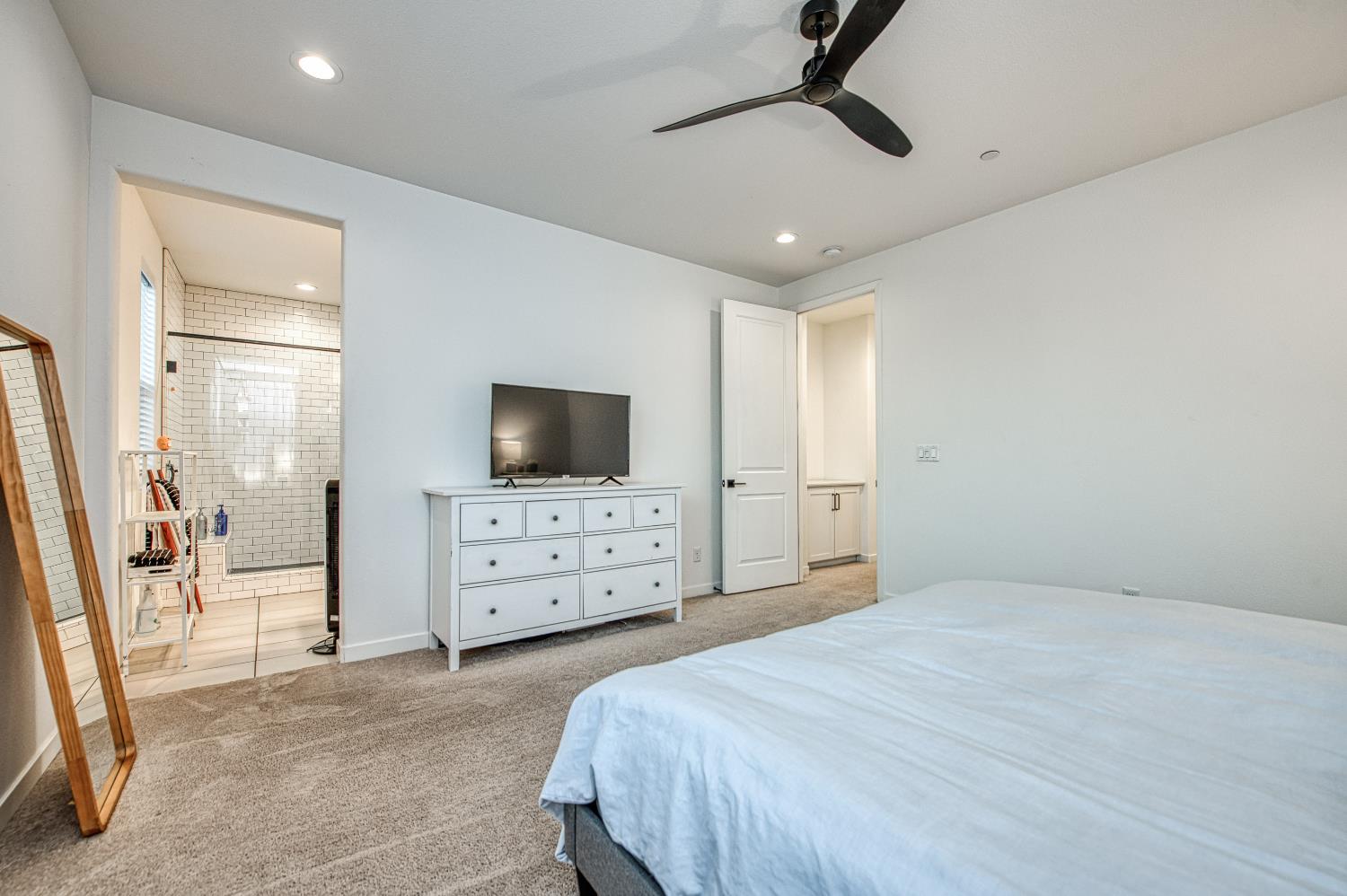 4311 San Miguel Road Madera, CA 93636 - Photo 36 of 79 a bedroom with a bed a flat screen tv and dresser