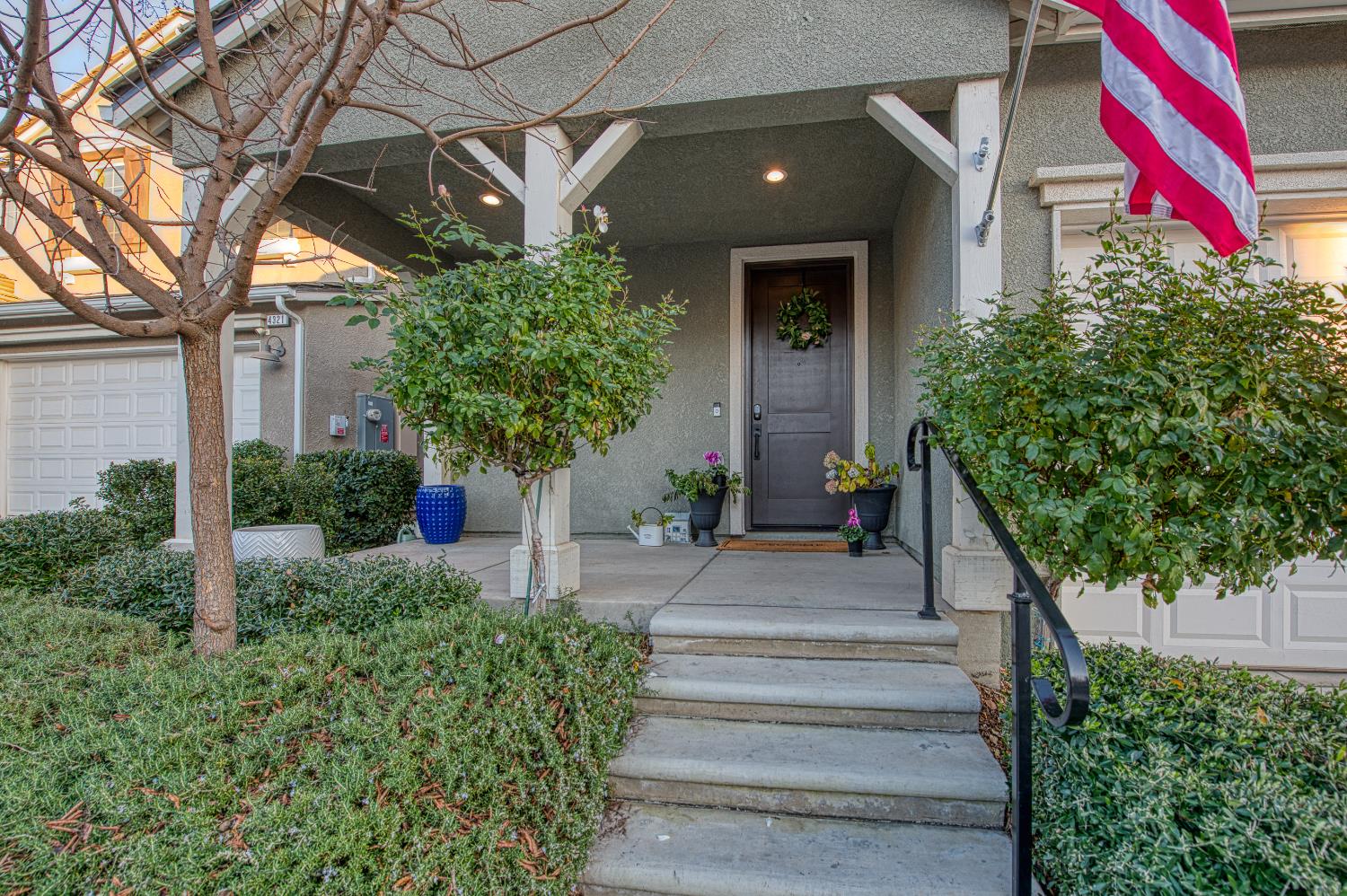4311 San Miguel Road Madera, CA 93636 - Photo 48 of 79 a front view of a house with a yard and potted plants