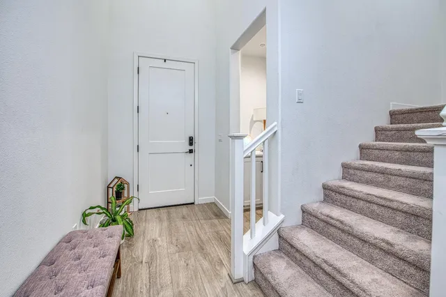 a kitchen with stainless steel appliances granite countertop a stove refrigerator and cabinets