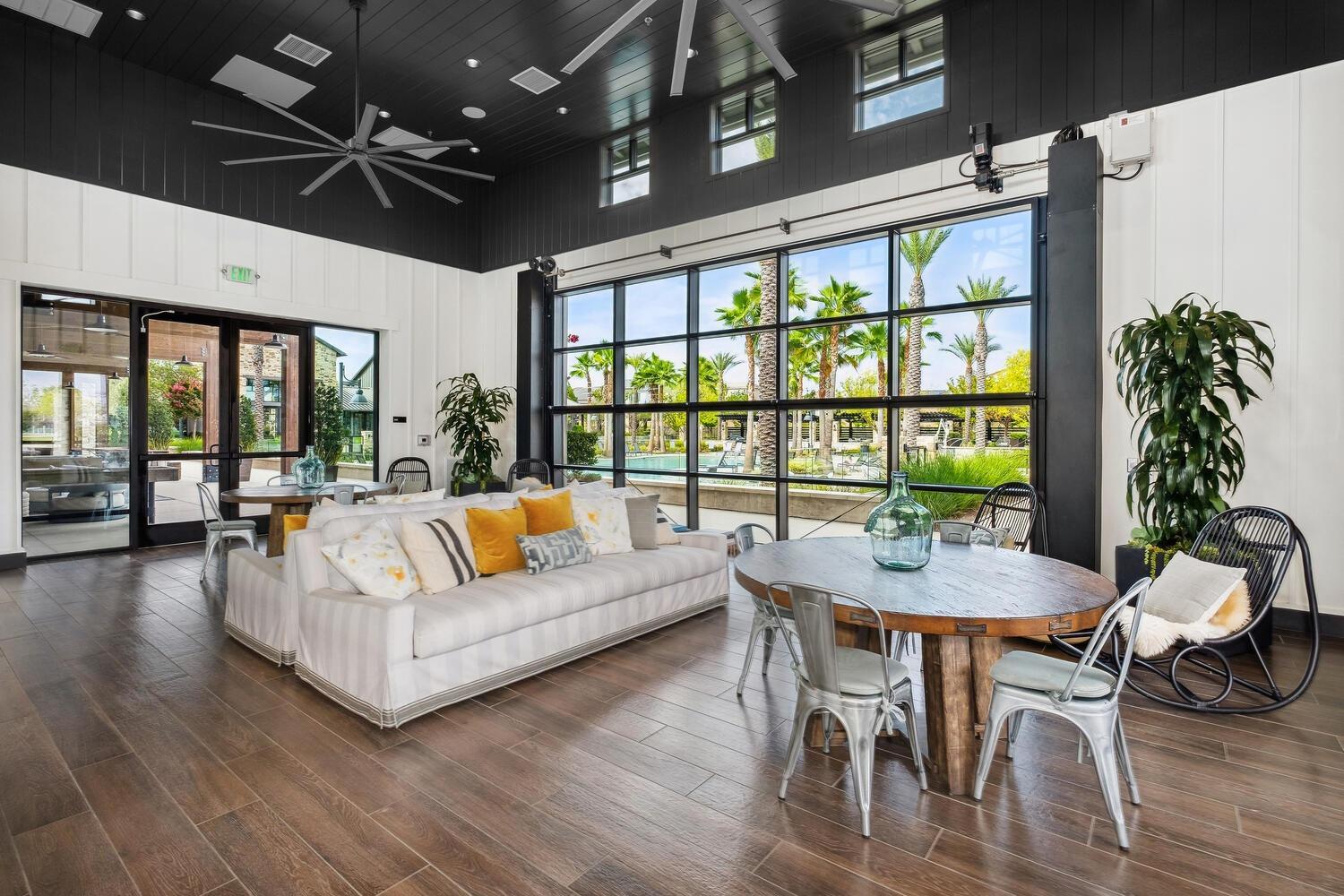 4311 San Miguel Road Madera, CA 93636 - Photo 76 of 79 a living room with furniture a potted plant and a large window