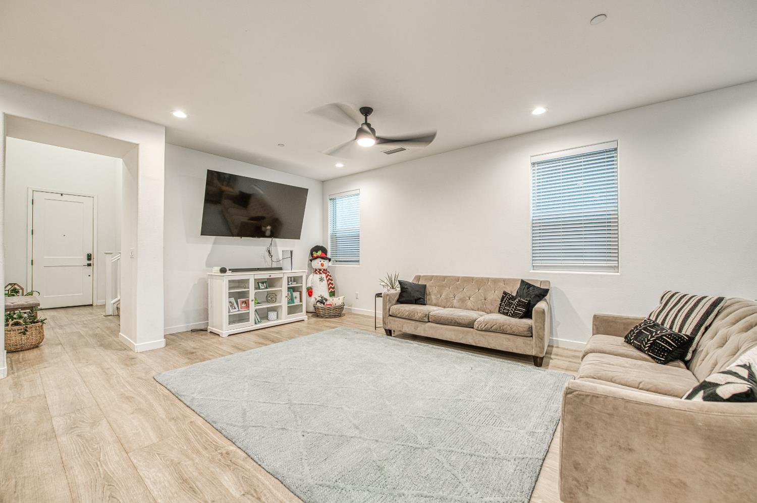 4311 San Miguel Road Madera, CA 93636 - Photo 8 of 79 a living room with furniture and a flat screen tv