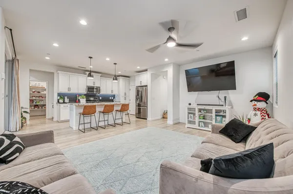 a living room with furniture and a window