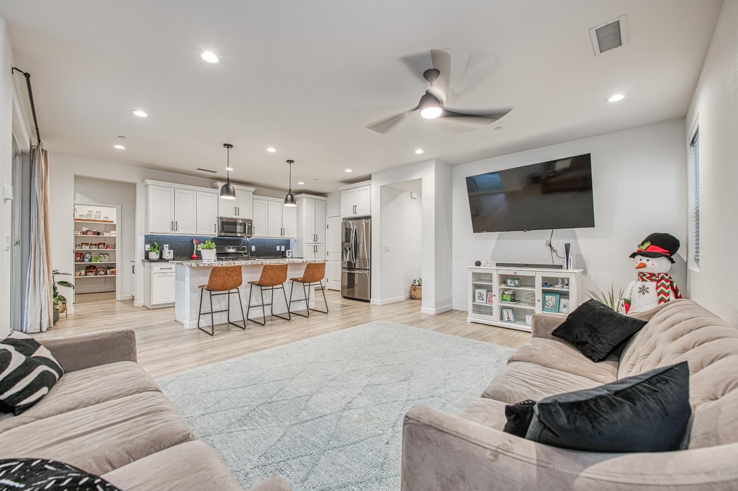 4311 San Miguel Road Madera, CA 93636 - Photo 10 of 79 a living room with furniture and a flat screen tv